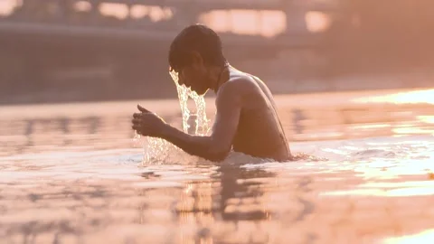 Slow motion shot of Man Coming out of River Stock Footage 241585228