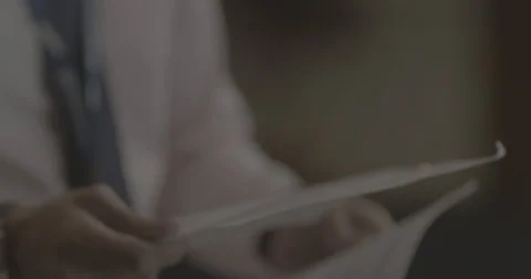 Slow Motion shot of Man dropping a paper - Shot on RED 5K Stock-Footage 113605116