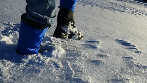 Slow motion shot of a man hiking through deep snow Stock Footage 71882748