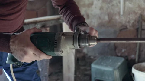 Slow motion shot of a man working a drill Stock Footage 147104219