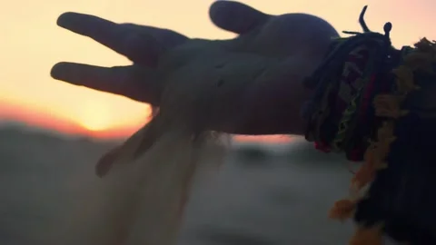 Slow motion shot of a man's hand moving through sand in the Desert. Stock Footage 239093476