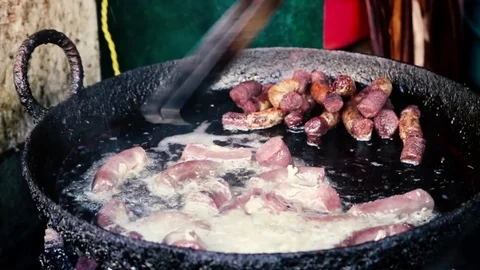 Slow motion shot of meat frying in pan Stock Footage