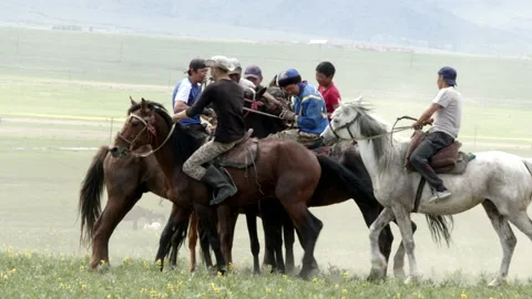 Slow motion shot of men playing Kok Boru in Krygyzstan Stock Footage 197282126