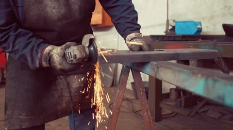 Slow motion shot of Metal worker grinding in factory Stock Footage 62258975