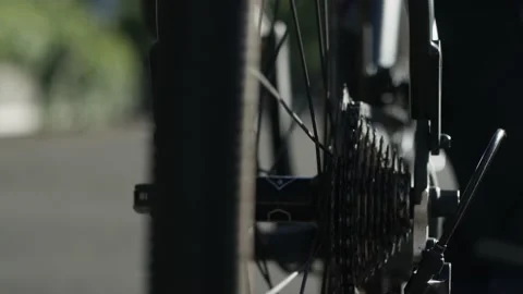 Slow motion shot of a moving bicycle wheel Stock Footage 132707920