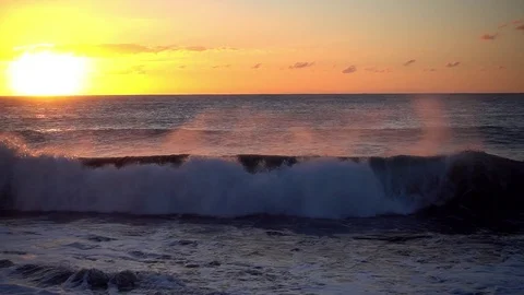 Slow motion shot of ocean waves in sunset lights Stock Footage 71580165
