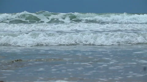 Slow Motion Shot Of Ocean Waves Crashing On Sandy Beach Stock Footage 240693982
