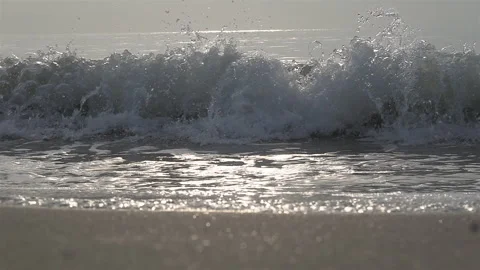 Slow Motion Shot Of Ocean Waves Crashing On Sandy Beach Stock Footage 240782265