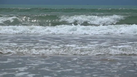 Slow Motion Shot Of Ocean Waves Crashing On Sandy Beach Stock Footage 249087545
