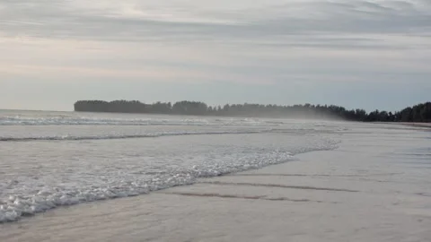 Slow motion shot of ocean waves onto the beach in Phuket, Thailand Stock Footage 327527380