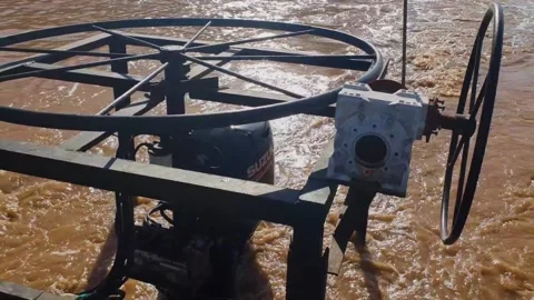 Slow motion shot of old engine of ferry boat driving on dirty water during Video stock 148357042
