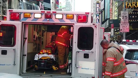Slow motion shot of paramedics preparing their equipment in the streets of 動画素材 108286569