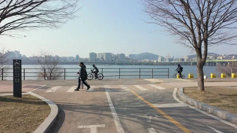 Slow motion shot of people doing activity at Hangang Park in Seoul, South Kor Stock Footage 303232556