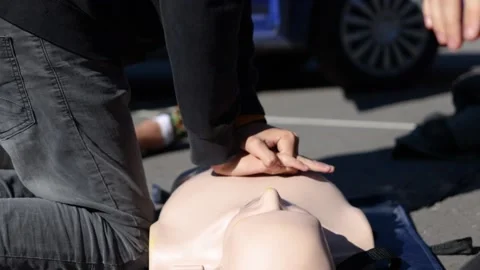 Slow motion shot of people at First Aid Cardiopulmonary Resuscitation Stock Footage 170939267