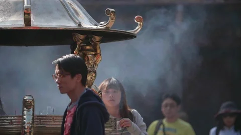 Slow motion shot of people make merit in Chinese Lunar New Year's Eve Stock Footage 88849935