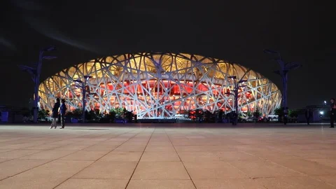 Slow motion shot of people walking in front of the Beijing National Vídeo Stock 107513672