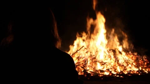 Slow motion shot of person's silhouette by the fire Stock Footage 122801454