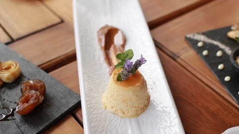 Slow Motion Shot of Platted Gourmet Flan Stock Footage 121716407