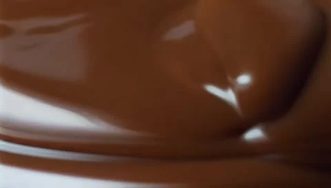Slow motion shot pouring melted chocolate, close-up seamless Stock Footage 300014680