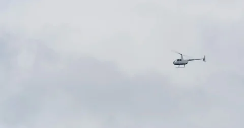 Slow motion shot of a private helicopter in Los Angeles, California. Stock Footage 115075595