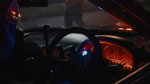 Slow Motion Shot Pulling Back to Reveal a Driver Before a Drift Event. Stock Footage 148819796