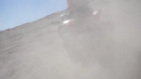 Slow motion shot of quad with big sand ejection and smoke Stock Footage 64670167