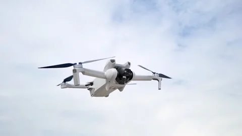 Slow motion shot of quadcopter drone flying in the sky. Loop footage. Stock Footage 247407027