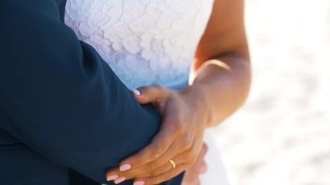 Slow motion shot of a recently married couple holding hands with wedding Stock-Footage 120721921