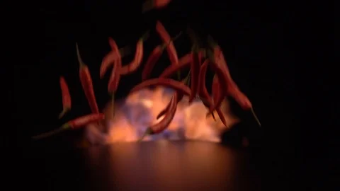 Slow Motion Shot of Red Chilli Peppers and Fire Explosion Stock Footage 124652532