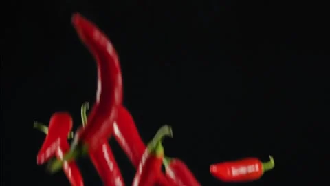 Slow Motion Shot of Red Chilli Peppers and Fire Explosion Stock Footage 139402483