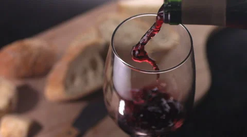 Slow motion shot of red wine being poured Stock-Footage 67340554