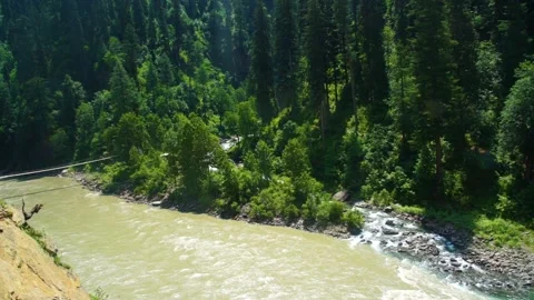 Slow motion shot of river with lush green mountains in hilly area of Pakista Stock Footage 200751919