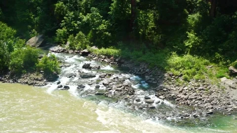 Slow motion shot of river with lush green mountains in hilly area of Pakista Stock Footage 200751948