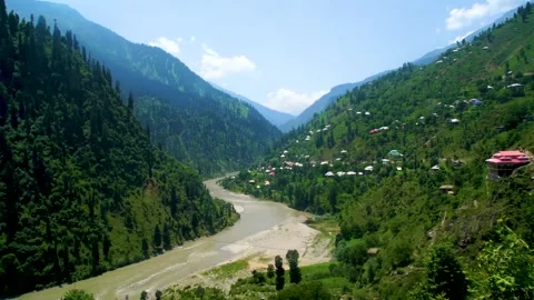 Slow motion shot of river with lush green mountains in hilly area of Pakista Stock Footage 200751950
