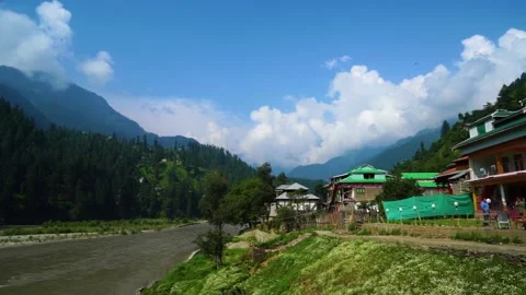 Slow motion shot of river with lush green mountains in hilly area of Pakista Stock Footage 200752284