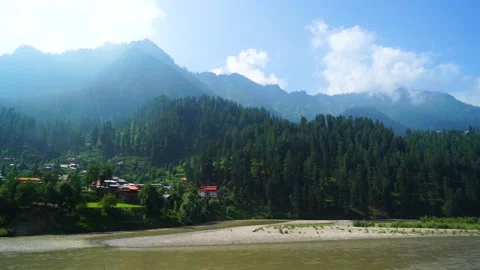 Slow motion shot of river with lush green mountains in hilly area of Pakista Stock Footage 200752290