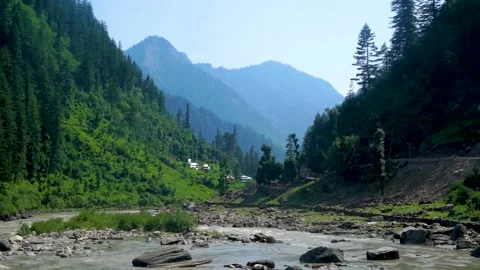 Slow motion shot of river with lush green mountains in hilly area of Pakista Stock Footage 200752294