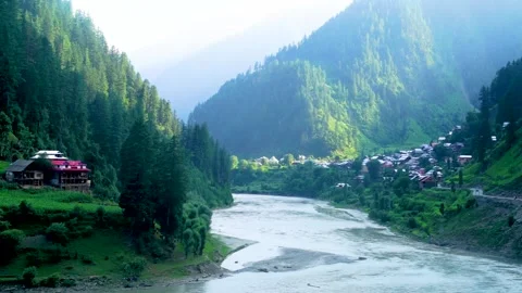 Slow motion shot of river with lush green mountains in hilly area of Pakista Stock Footage 200753042