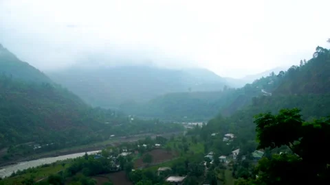 Slow motion shot of river with lush green mountains in hilly area of Pakista Stock Footage 200753140