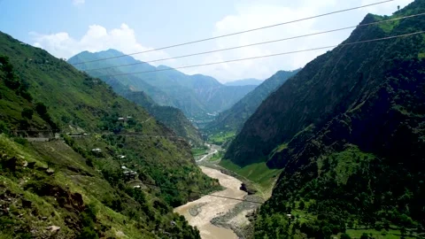 Slow motion shot of river with lush green mountains in hilly area of Pakista Stock Footage 200753871