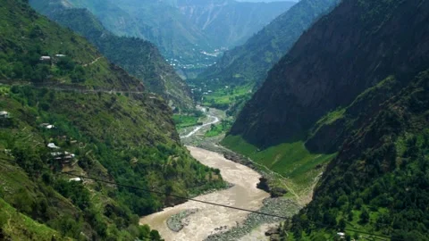 Slow motion shot of river with lush green mountains in hilly area of Pakista Stock Footage 200754007