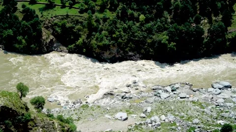 Slow motion shot of river with lush green mountains in hilly area of Pakista Stock Footage 200754532