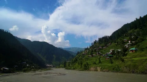 Slow motion shot of river with lush green mountains in hilly area of Pakista Stock Footage 200754830