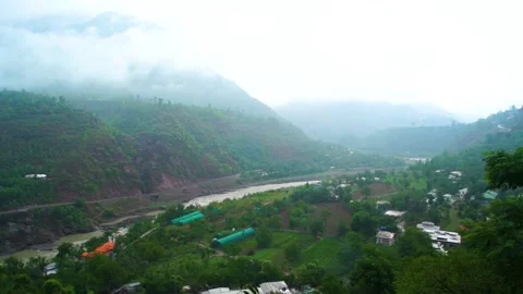 Slow motion shot of river with lush green mountains in hilly area of Pakista Stock Footage 200755047