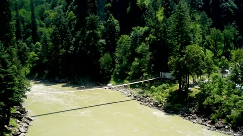 Slow motion shot of river with lush green mountains in hilly area of Pakista Stock Footage 200755196