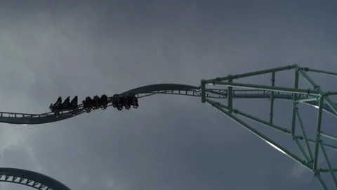 Slow motion shot of roller coaster ride against sky, California Stock Footage 121712113