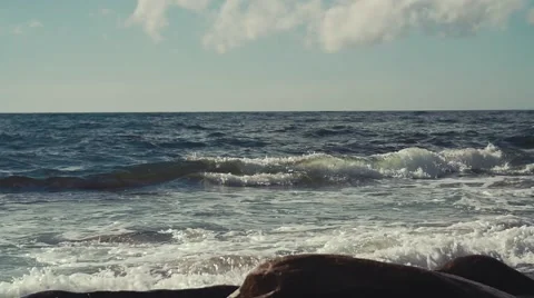 Slow motion shot of rough ocean waves falling on a shore Stock Footage 54263096