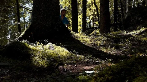 Slow motion shot of a runner running in the fir forest 動画素材 114178051