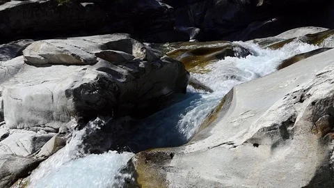 Slow motion shot of a rushing mountain rocky creek Stock-Footage 114178449