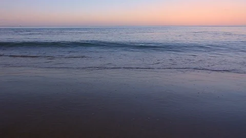 Slow Motion Shot of Sea Waves at Sunrise Stock Footage 124023353